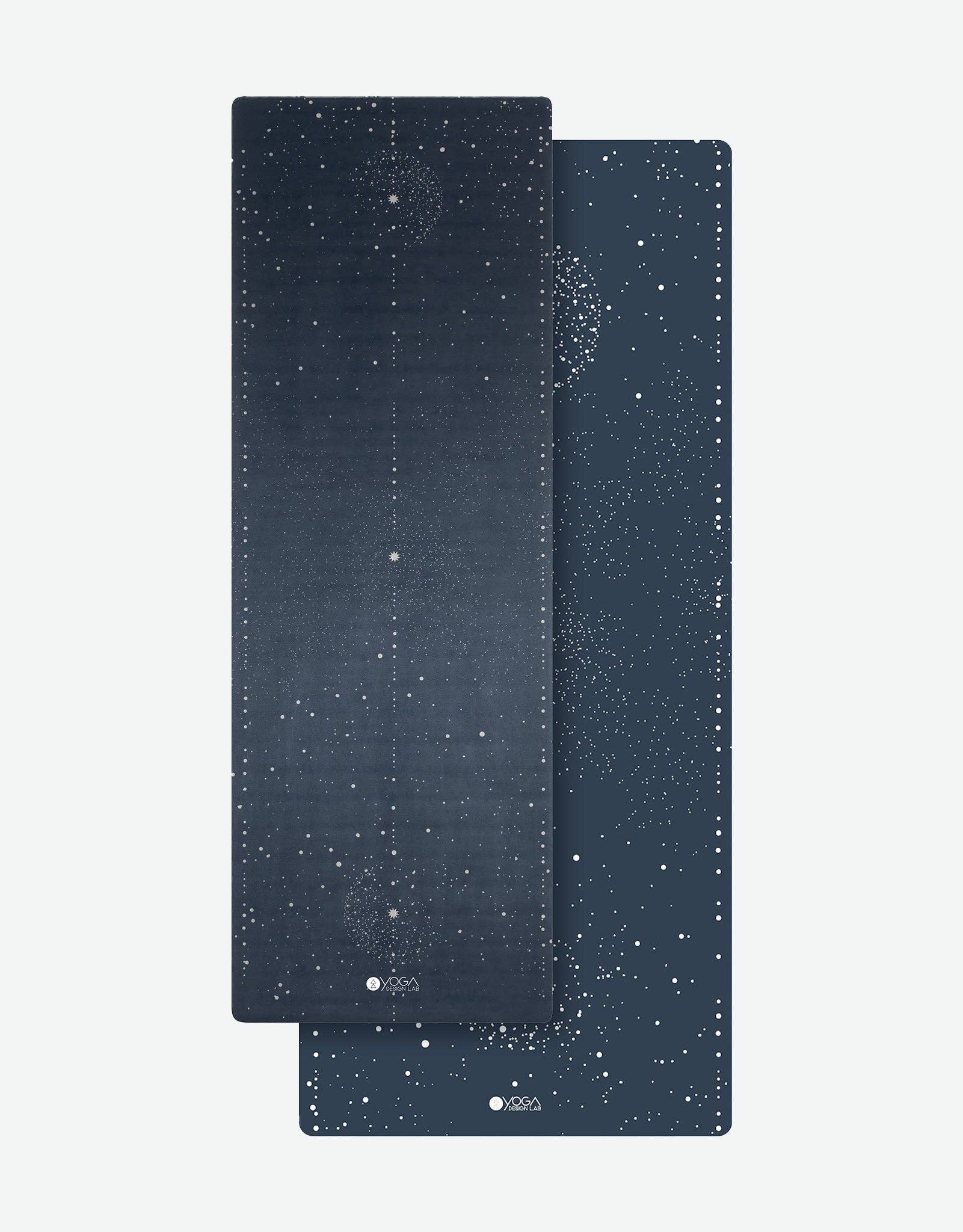 Two dark blue yoga mats with star pattern on a white background