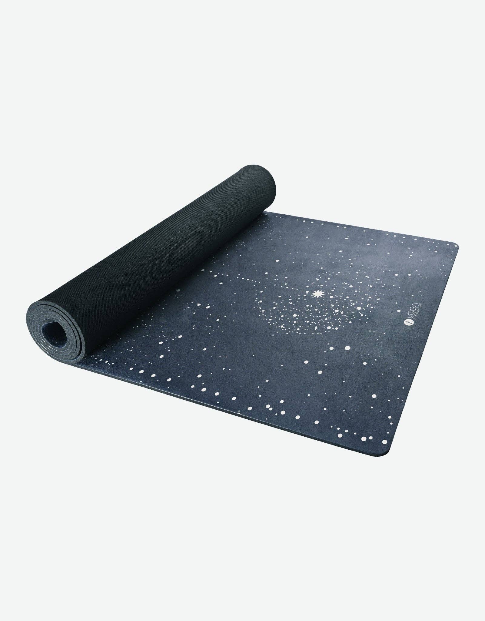 Black yoga mat with star pattern on a white background