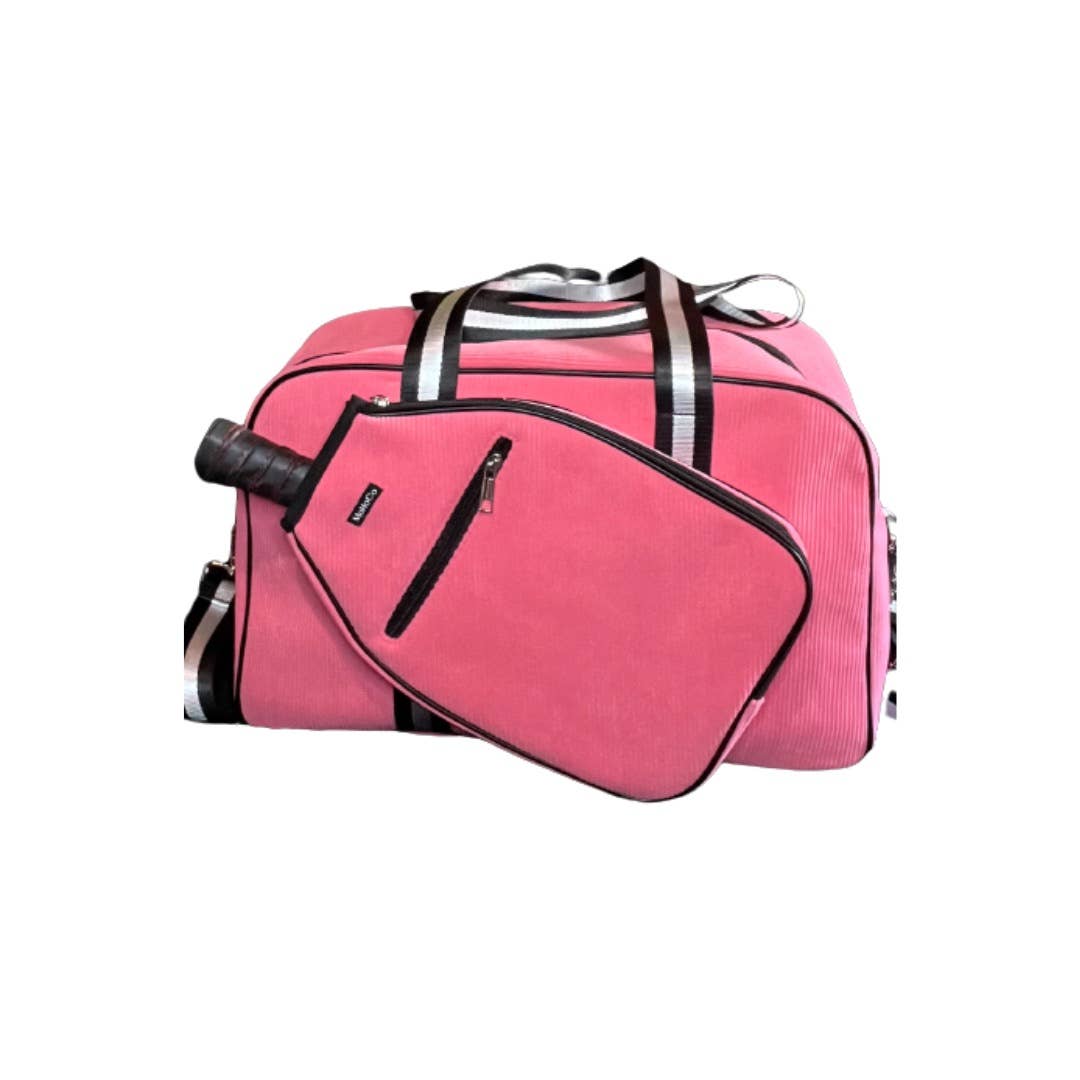 Pink duffel bag with a smaller black bag on top on a white background
